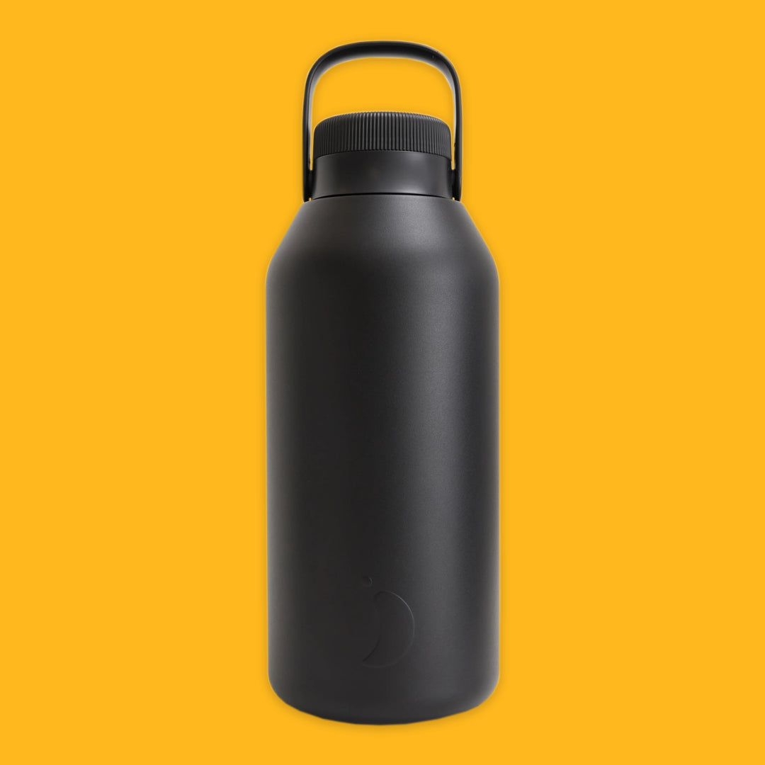 Black water bottle with a handle on a yellow background