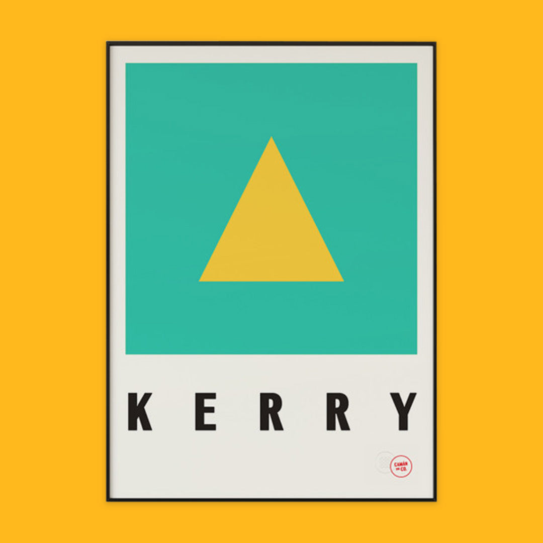 The phot shows a poster on an orange background. The poster is the county Kerry colours of yellow and green with the word Kerry written underneath.