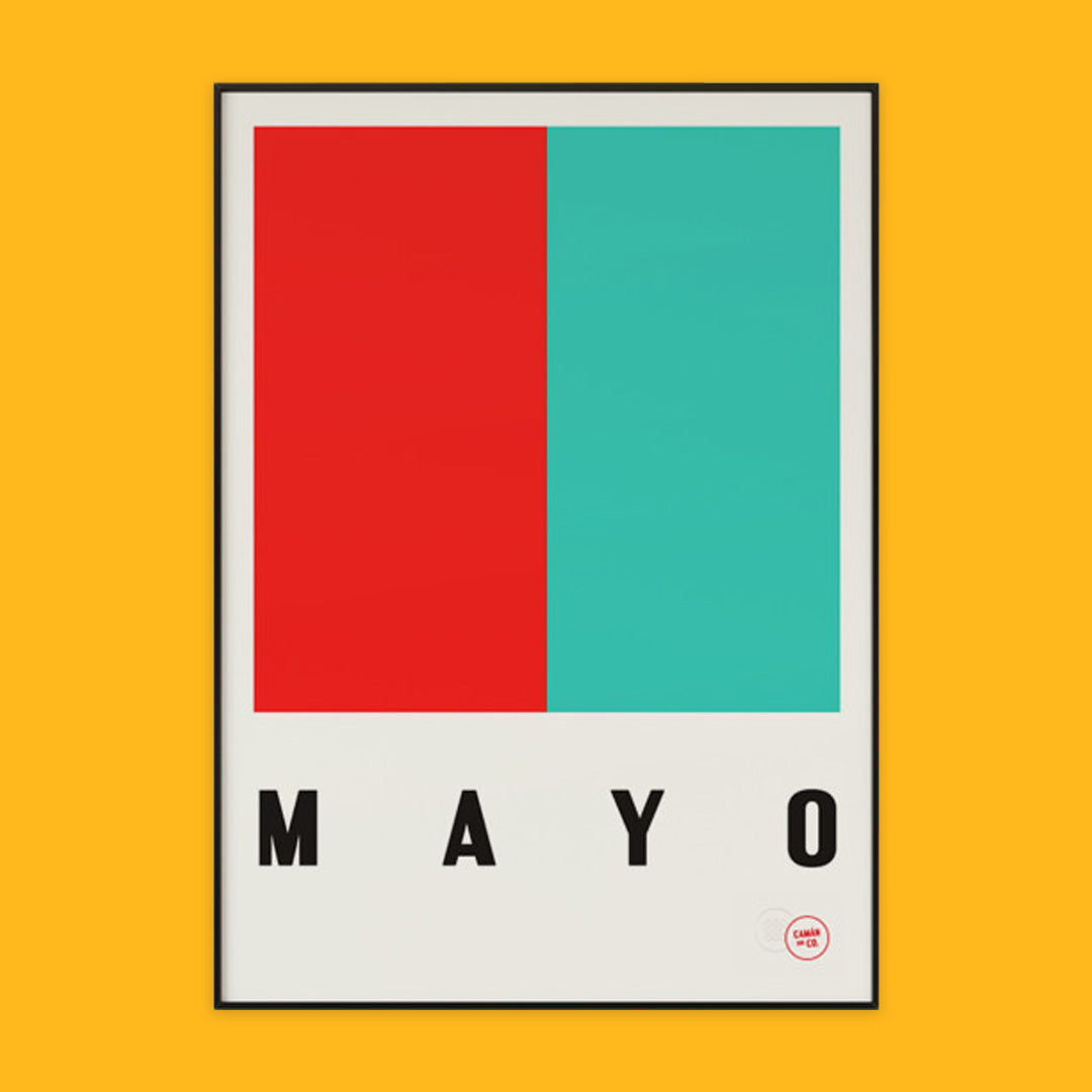 The photo shows a poster on an orange background. The poster is the county mayo colours of green and red with the word Mayo written underneath