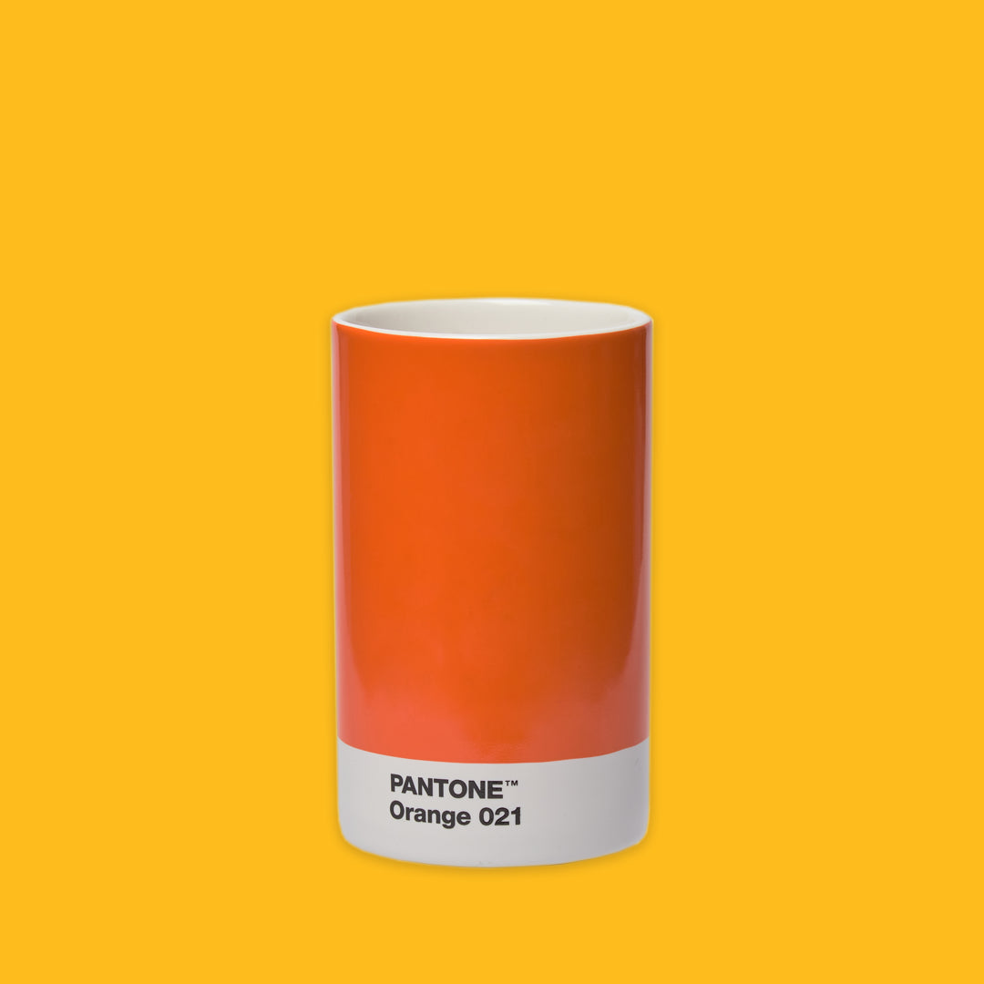Pantone Orange 021 Pencil Cup on a yellow background