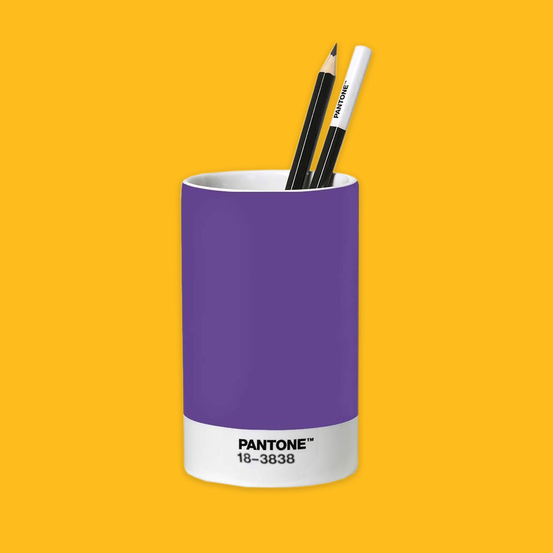Purple Pantone pen holder with two pens on a yellow background