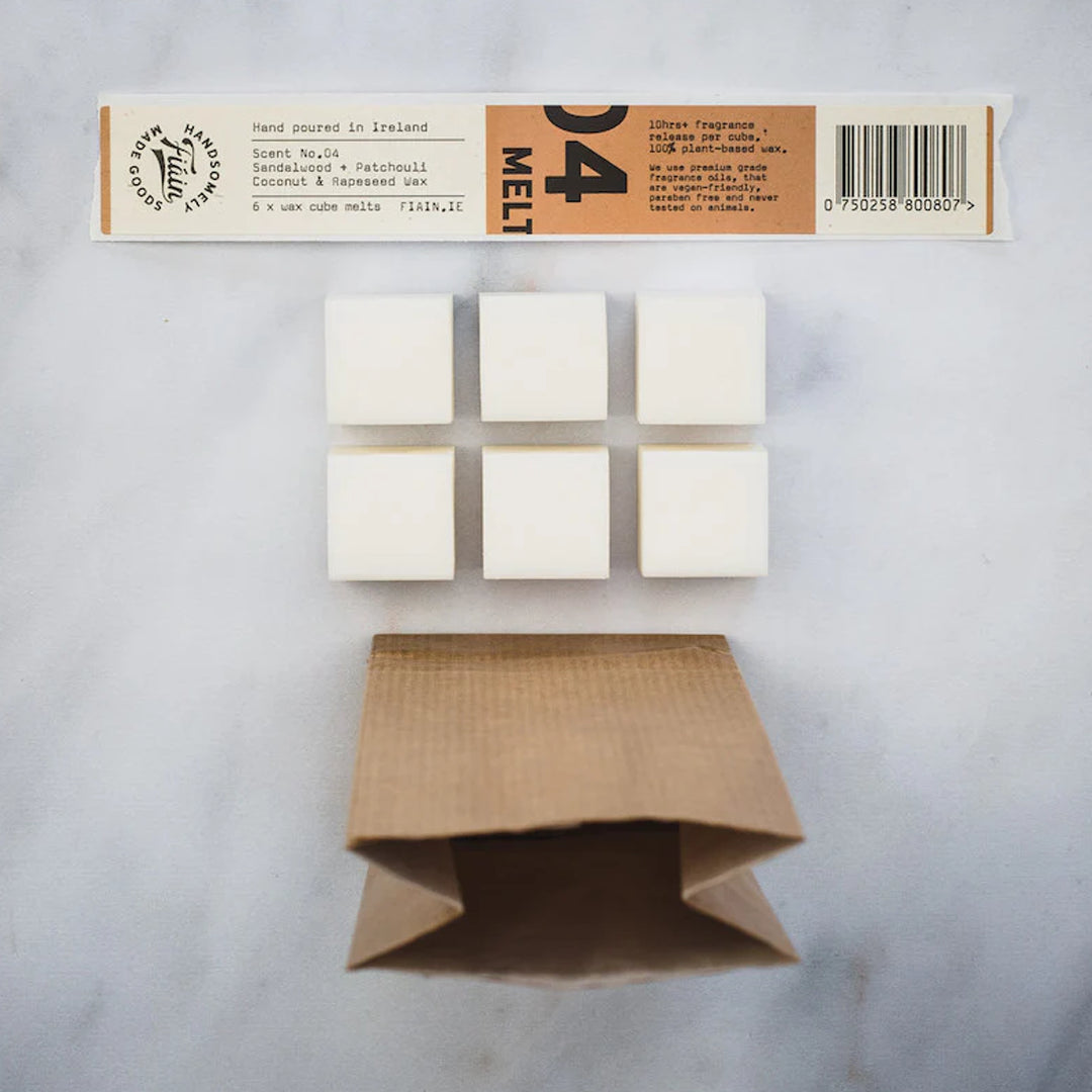 Fiáin Natural Wax Melts - Sandalwood & Patchoulli on a marble counter