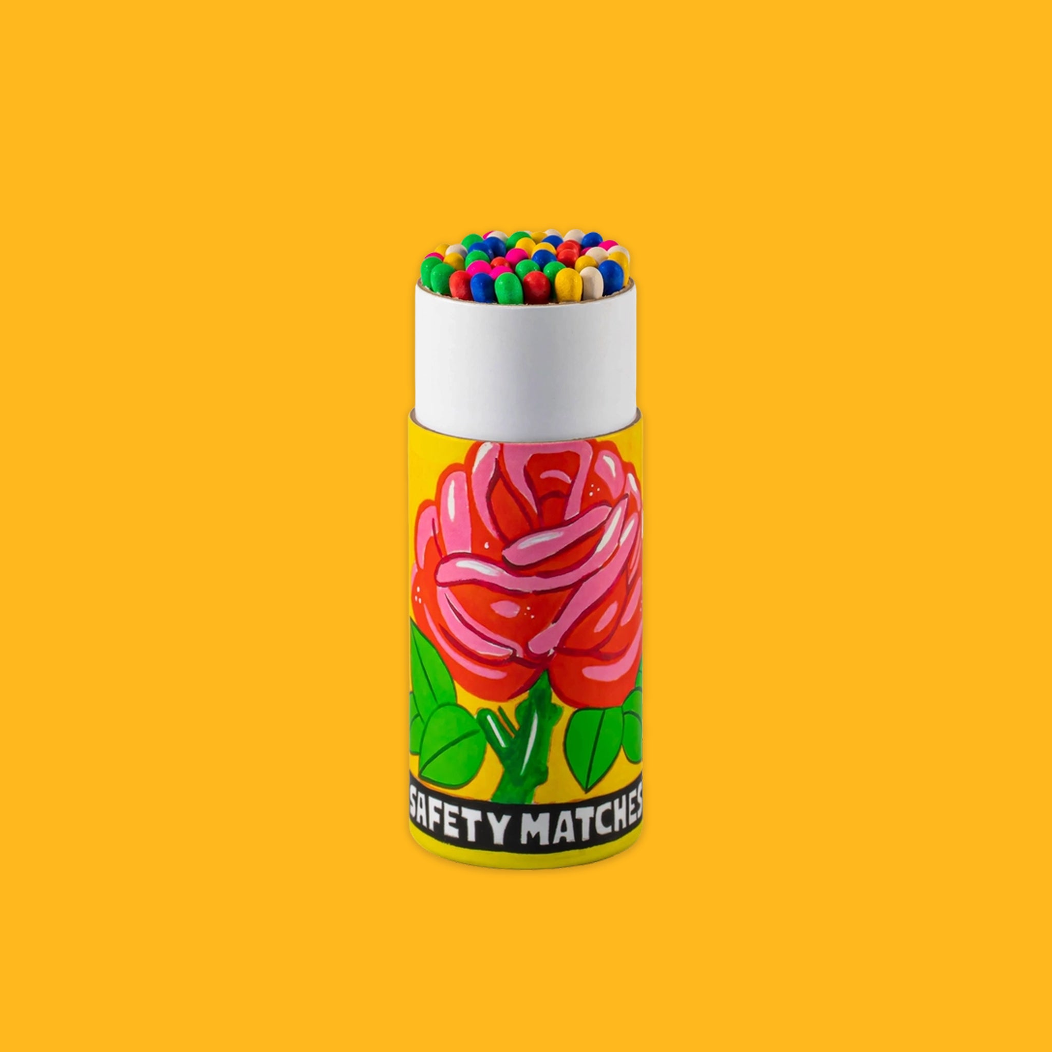 Matches cylinder with a rose on a yellow background