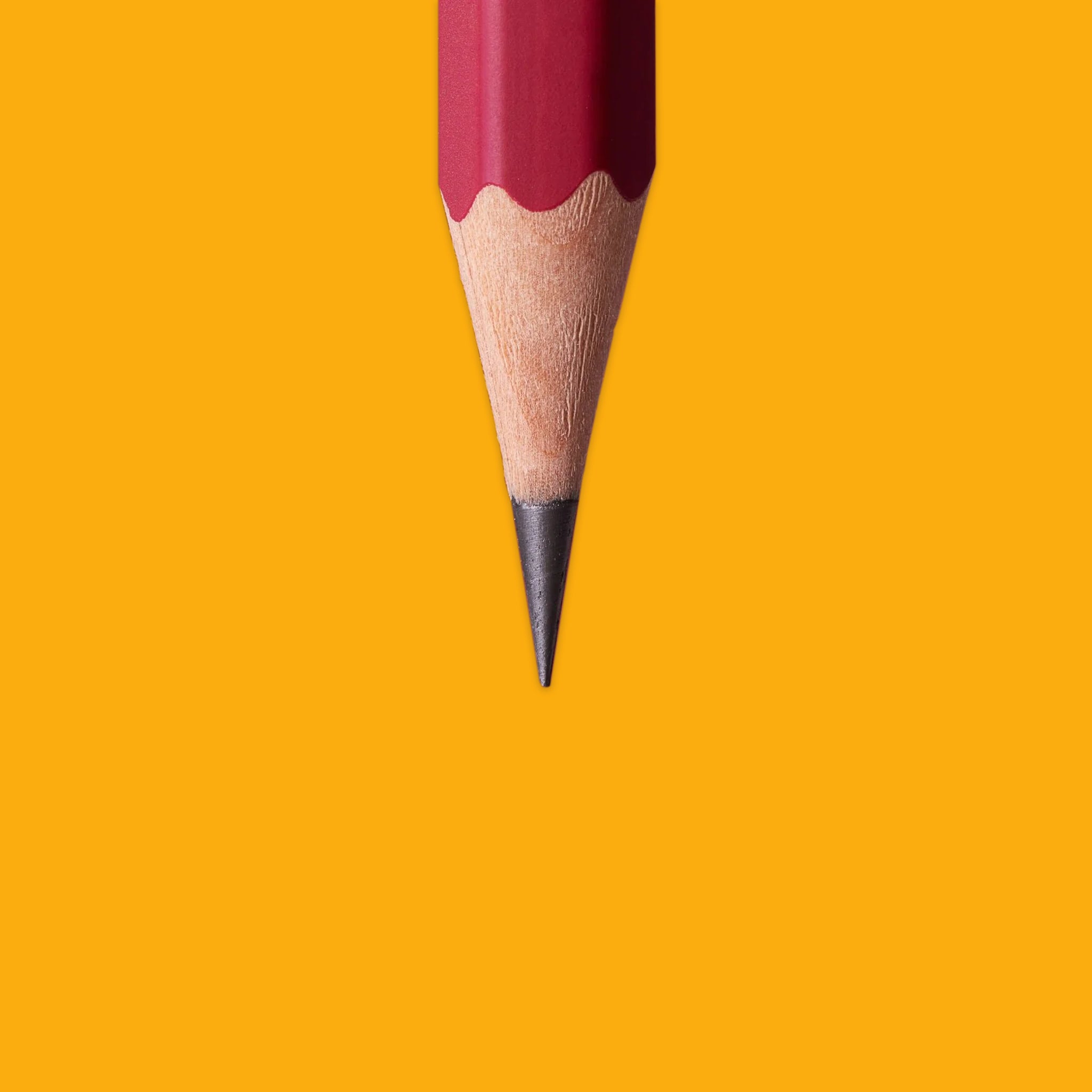 Red pencil on an yellow background