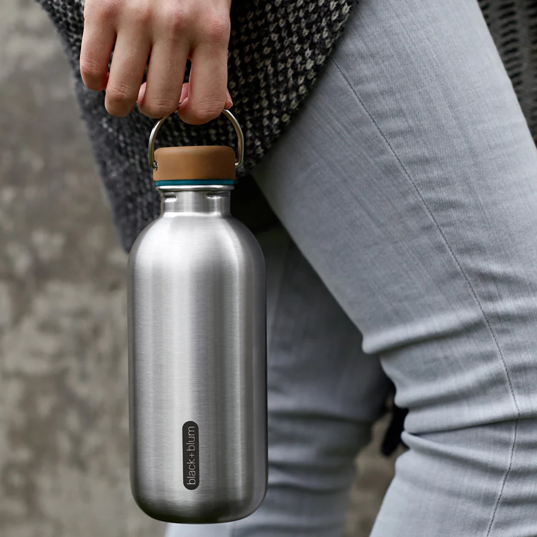 Steel bottle being carried by a walking person