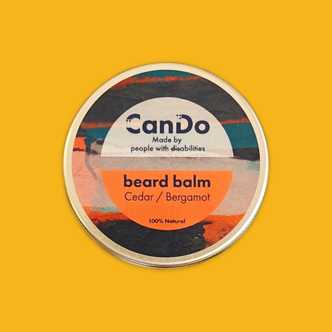 CanDo beard balm container on a yellow background