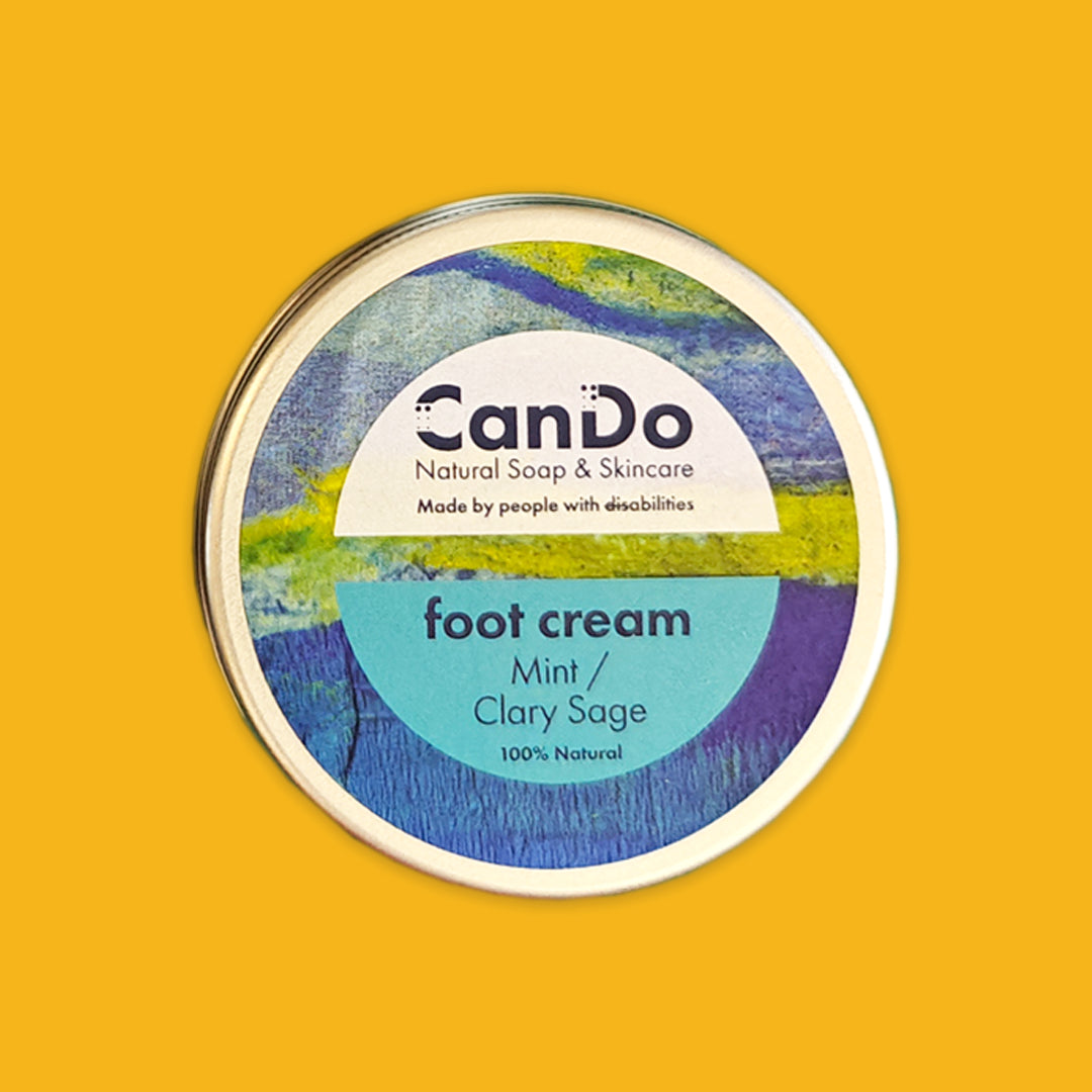 CanDo foot cream container on a yellow background