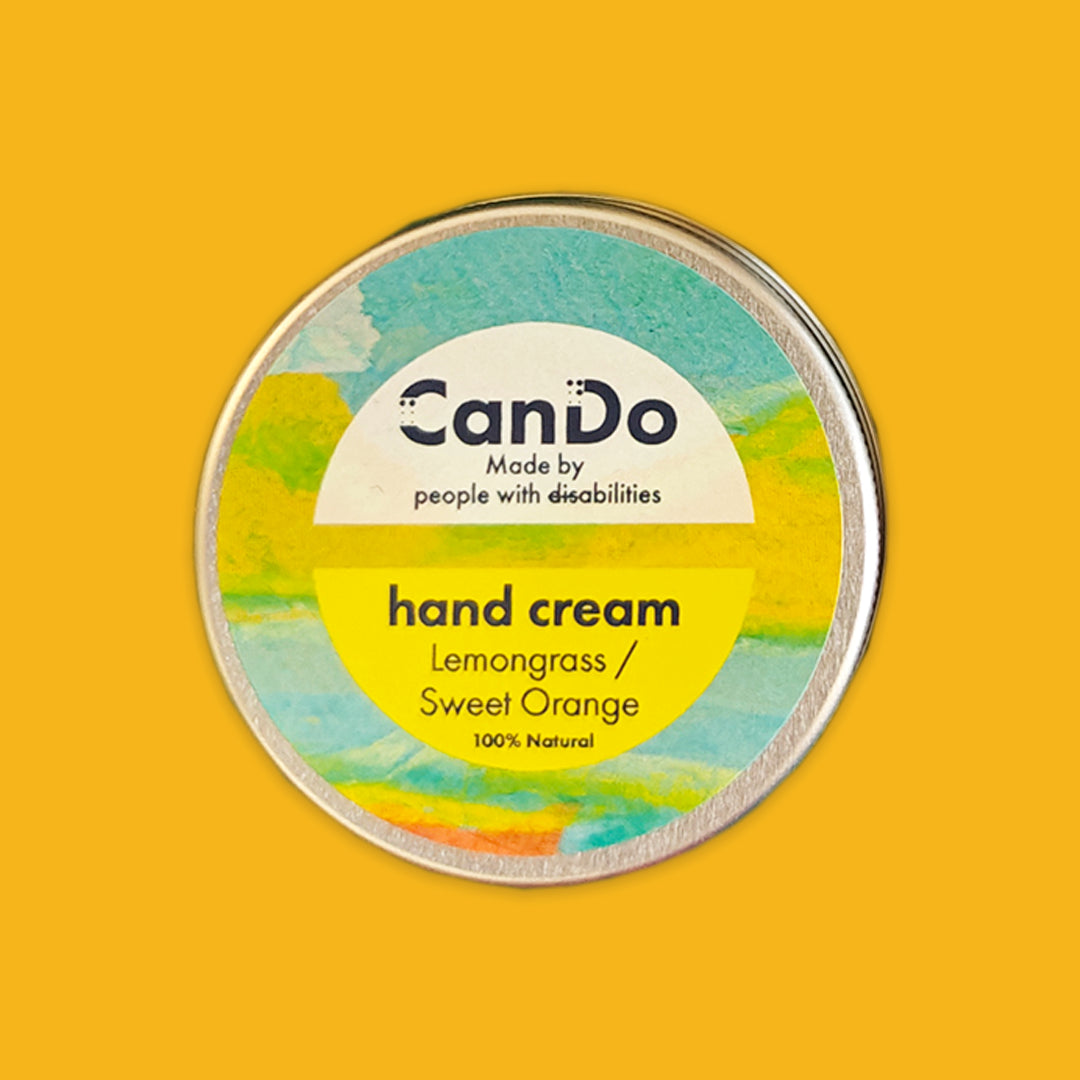 CanDo hand cream container with a colorful label on a yellow background