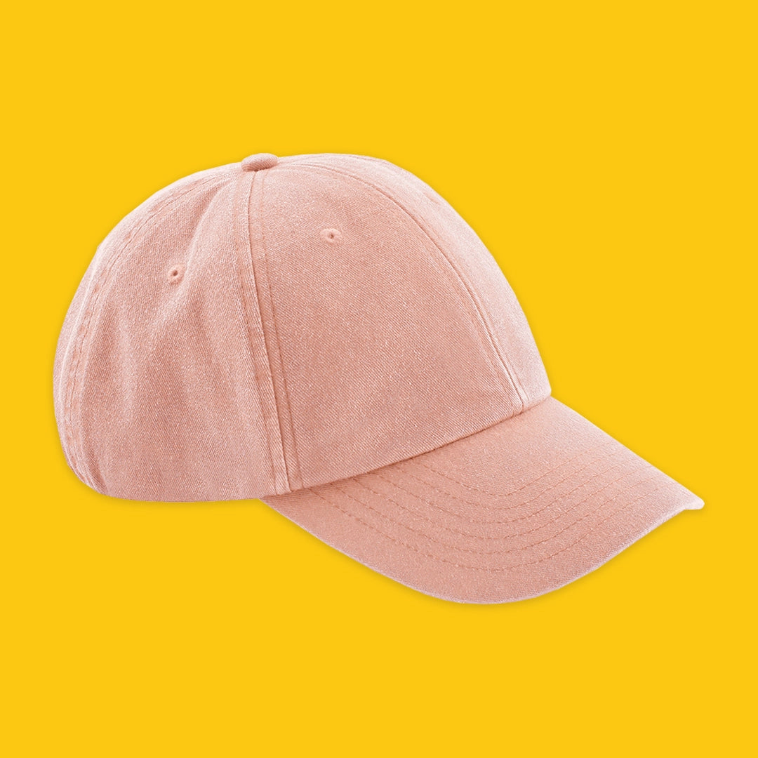 Organic Cotton Cap in Vintage Rose on a yellow background
