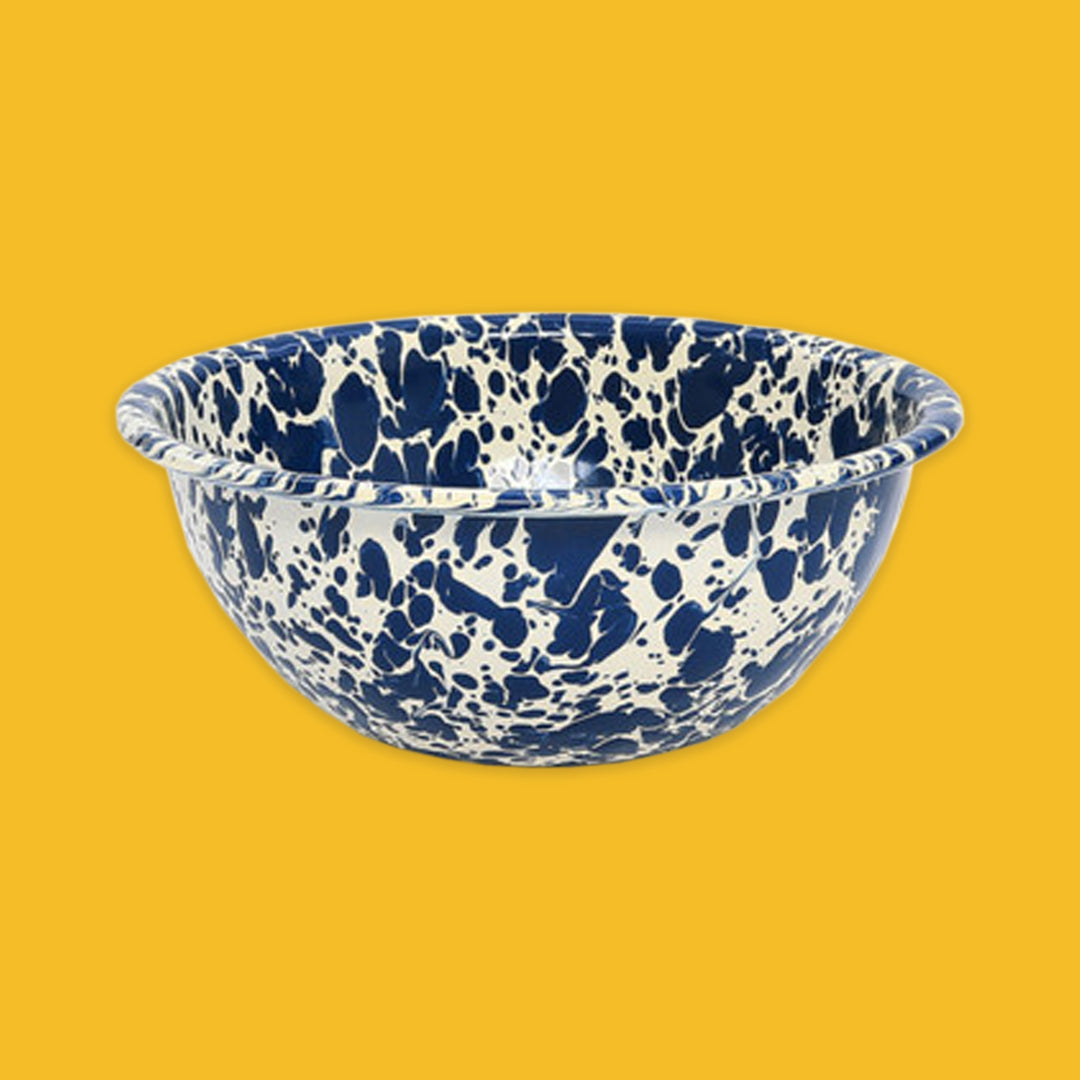 Navy and cream splatter bowl on a yellow background