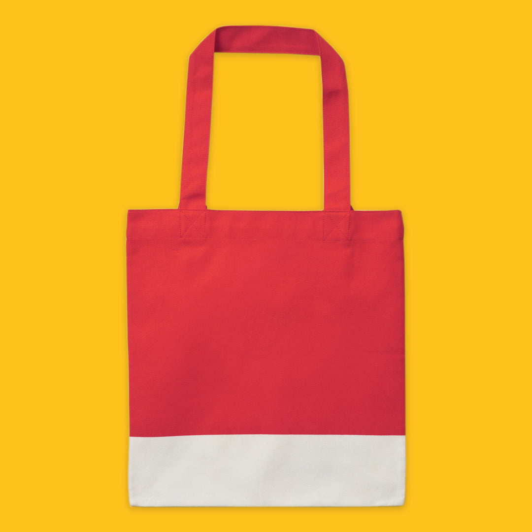 Red tote bag with white base on a yellow background