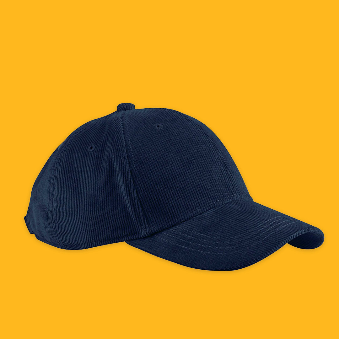 University blue cord cap on a yellow background