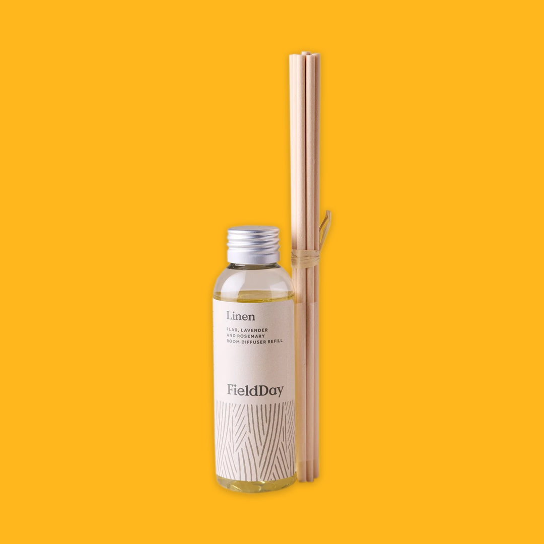 Fieldday Diffuser Refill in Linen on a yellow background