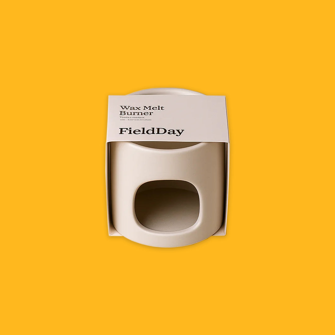 Stoneware wax burner on a yellow background