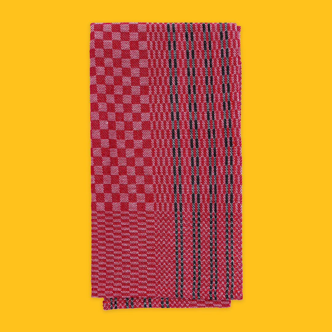 Folded Tea Towel in Red with Black Stripe on yellow background