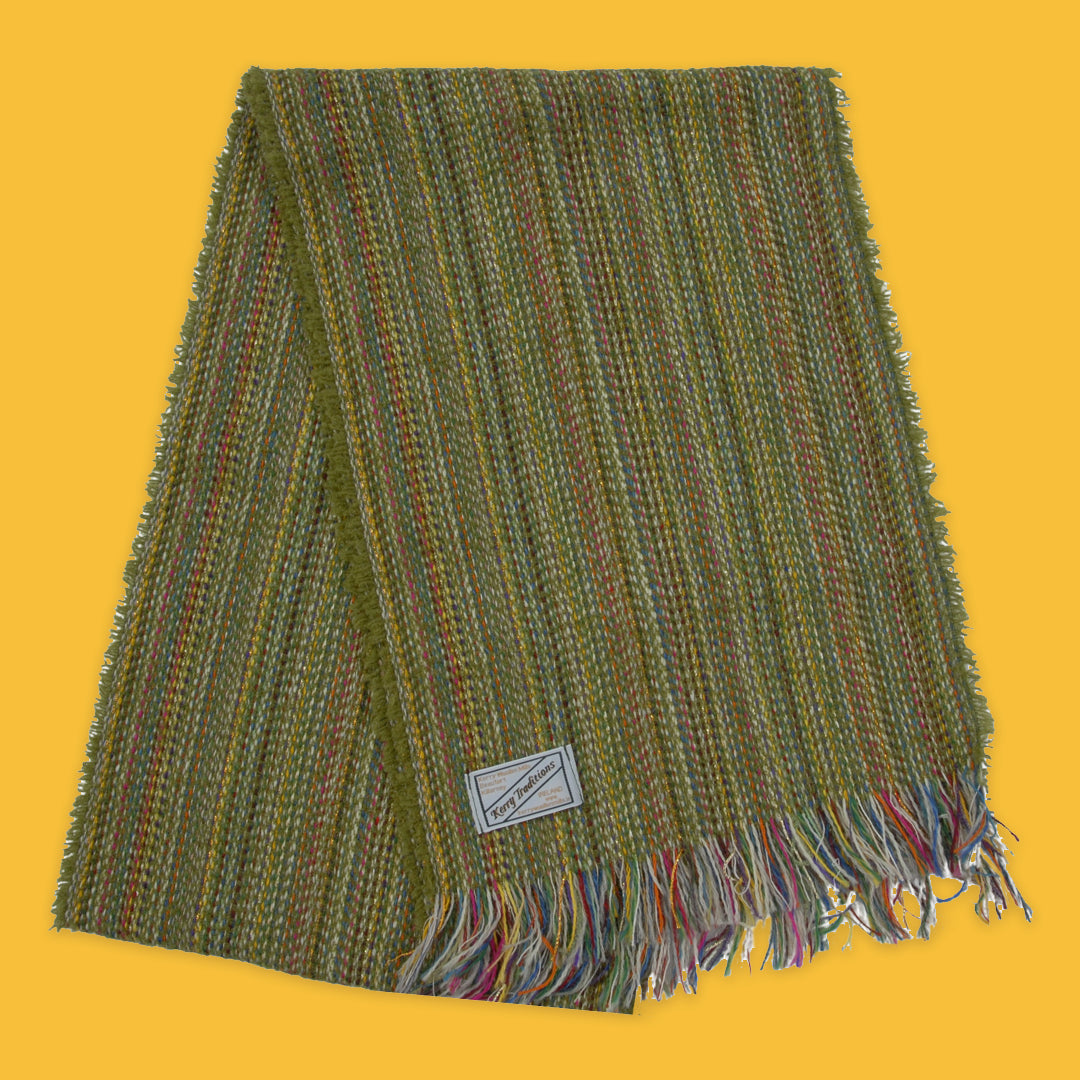 Lambswool Spectrum Scarf in Apple Green on a yellow background
