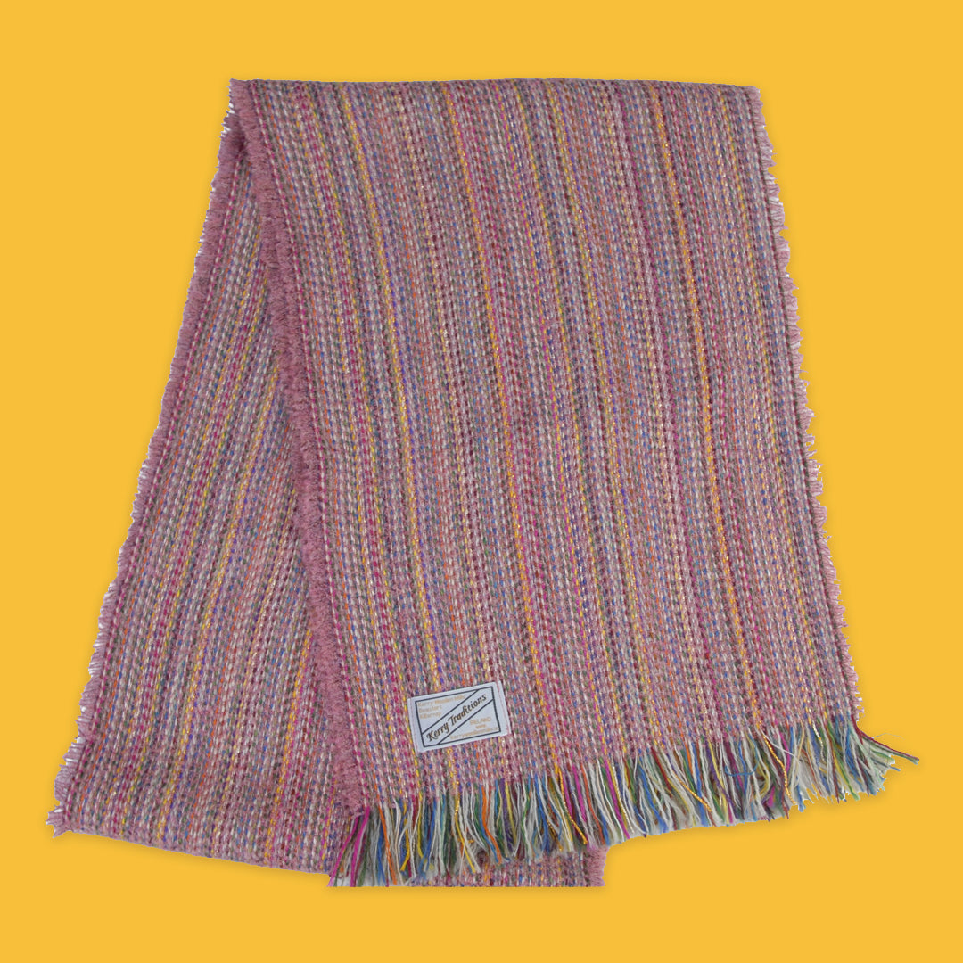 Lambswool Spectrum Scarf in Soft Nougat on a yellow background