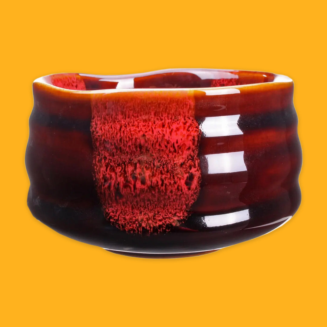 Red and Black match bowl on a yellow background