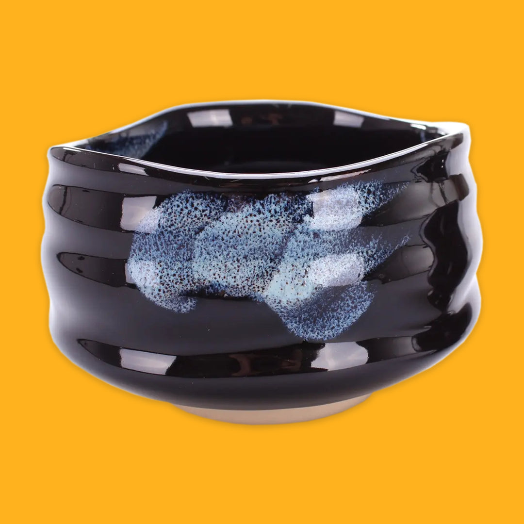 Black and Blue match bowl on a yellow background