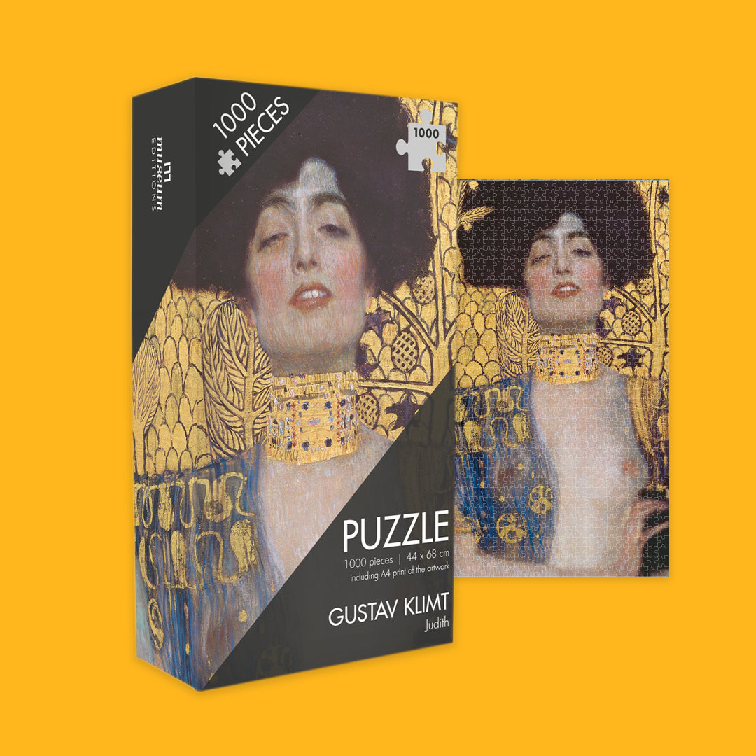 Jigsaw puzzle box featuring Gustav Klimt's artwork on a yellow background
