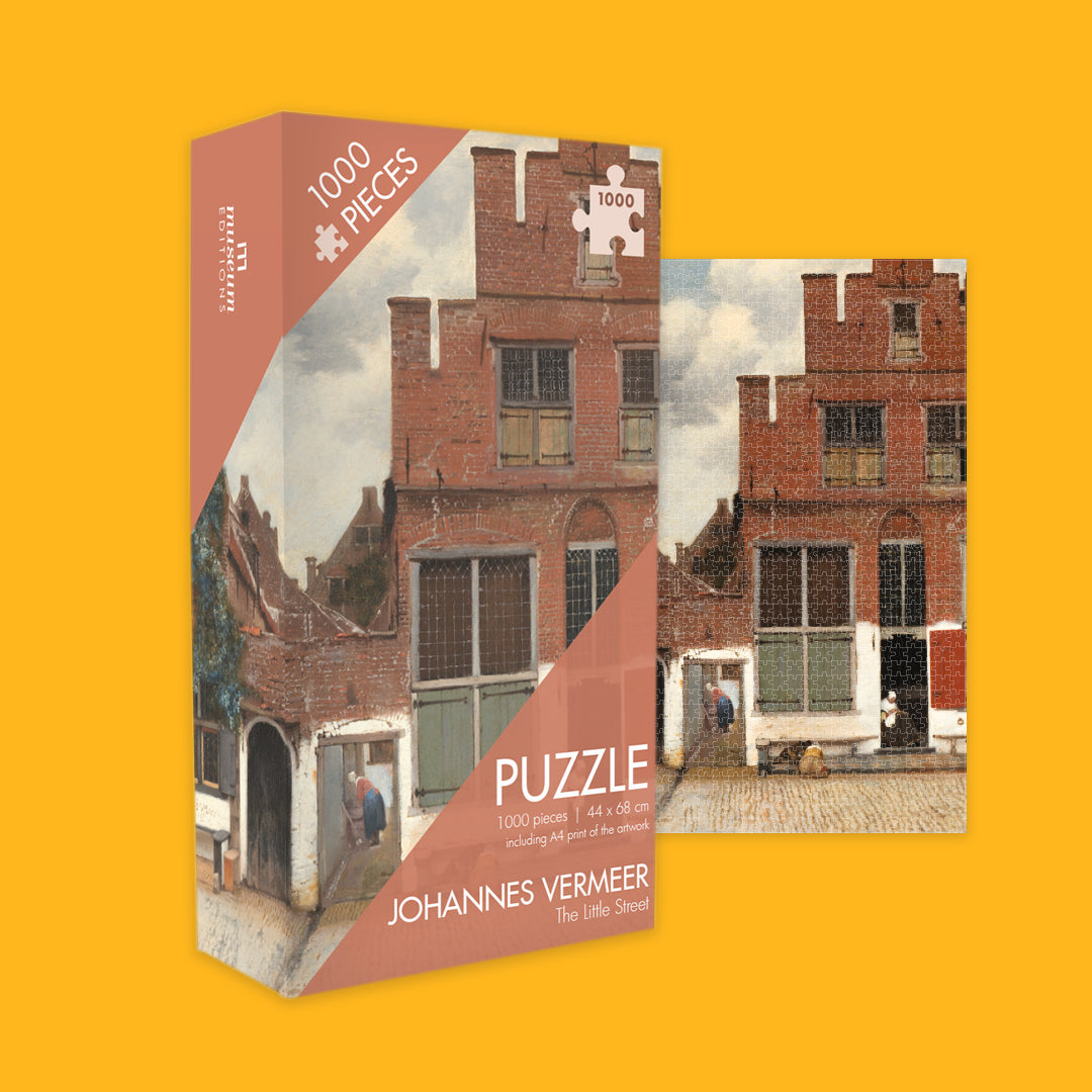 Johannes Vermeer puzzle box with a depiction of a street scene on an orange background