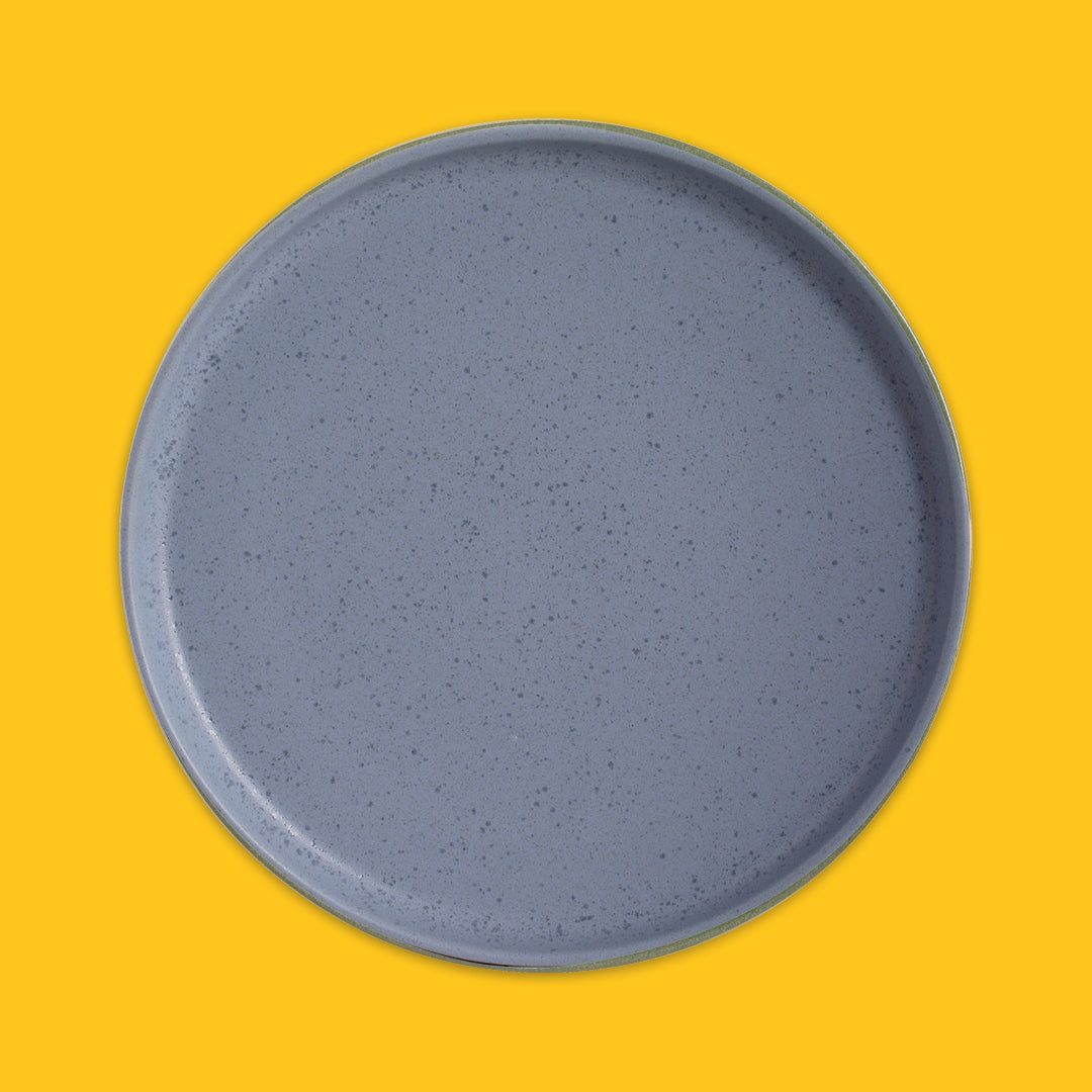 Round blue plate on a yellow background