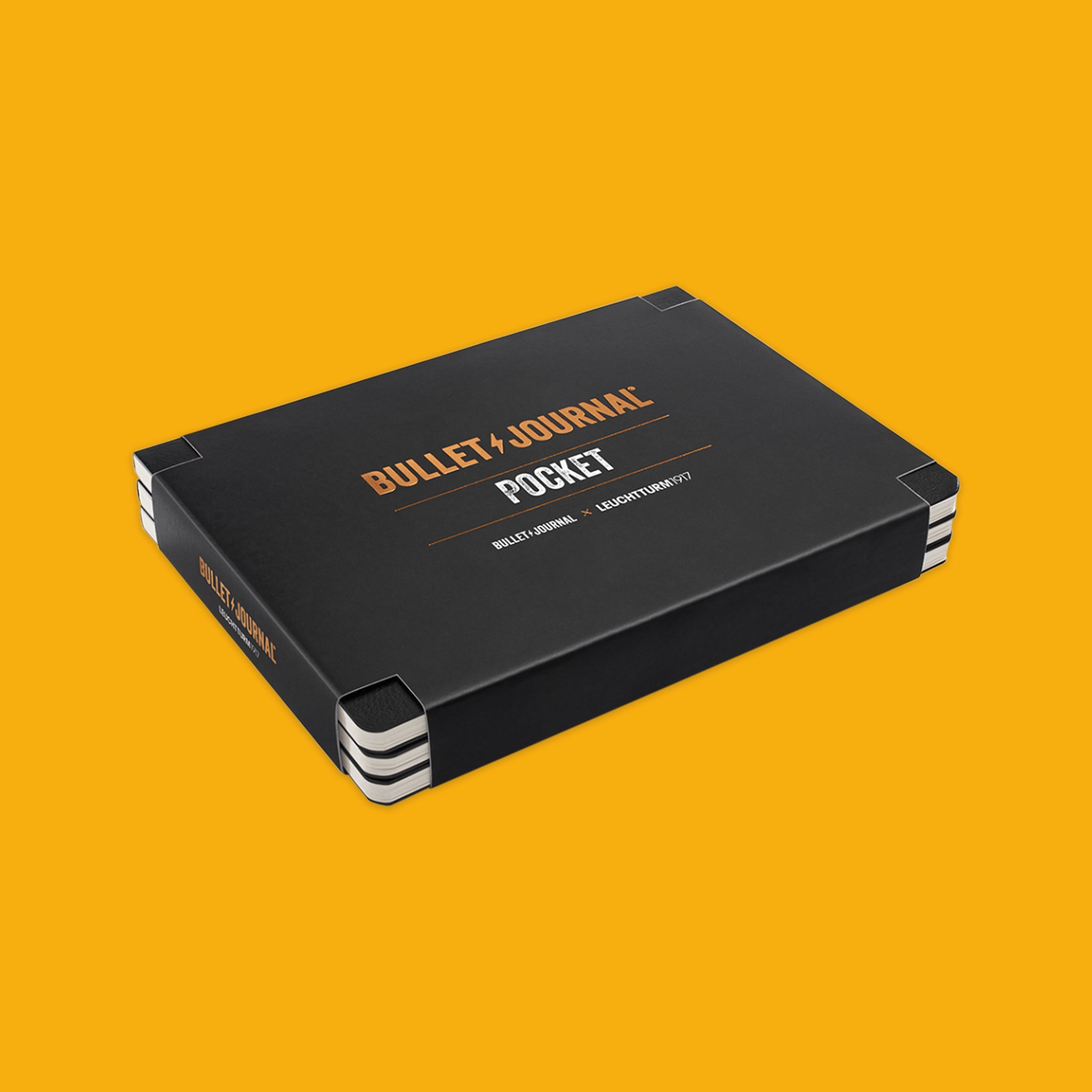 Black Pocket Bullet Journal 3-Pack on a yellow background