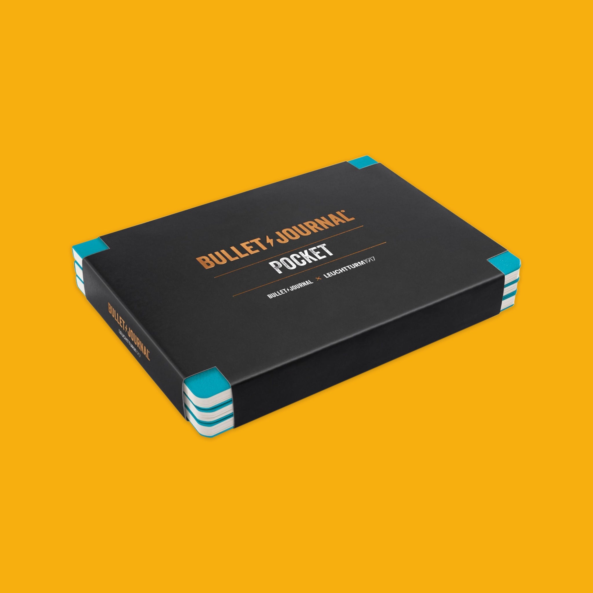 Turquoise Pocket Bullet Journal 3-Pack on a yellow background