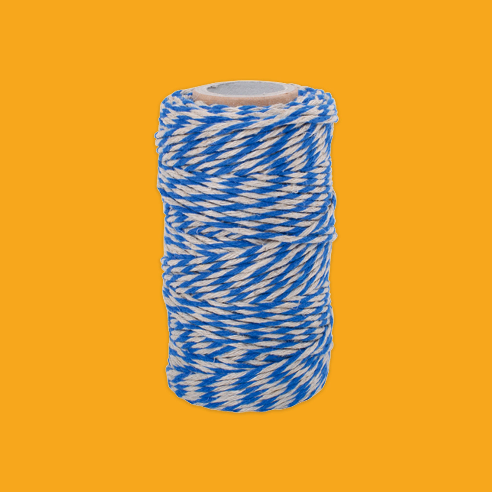 Roll of blue and white string on an orange background