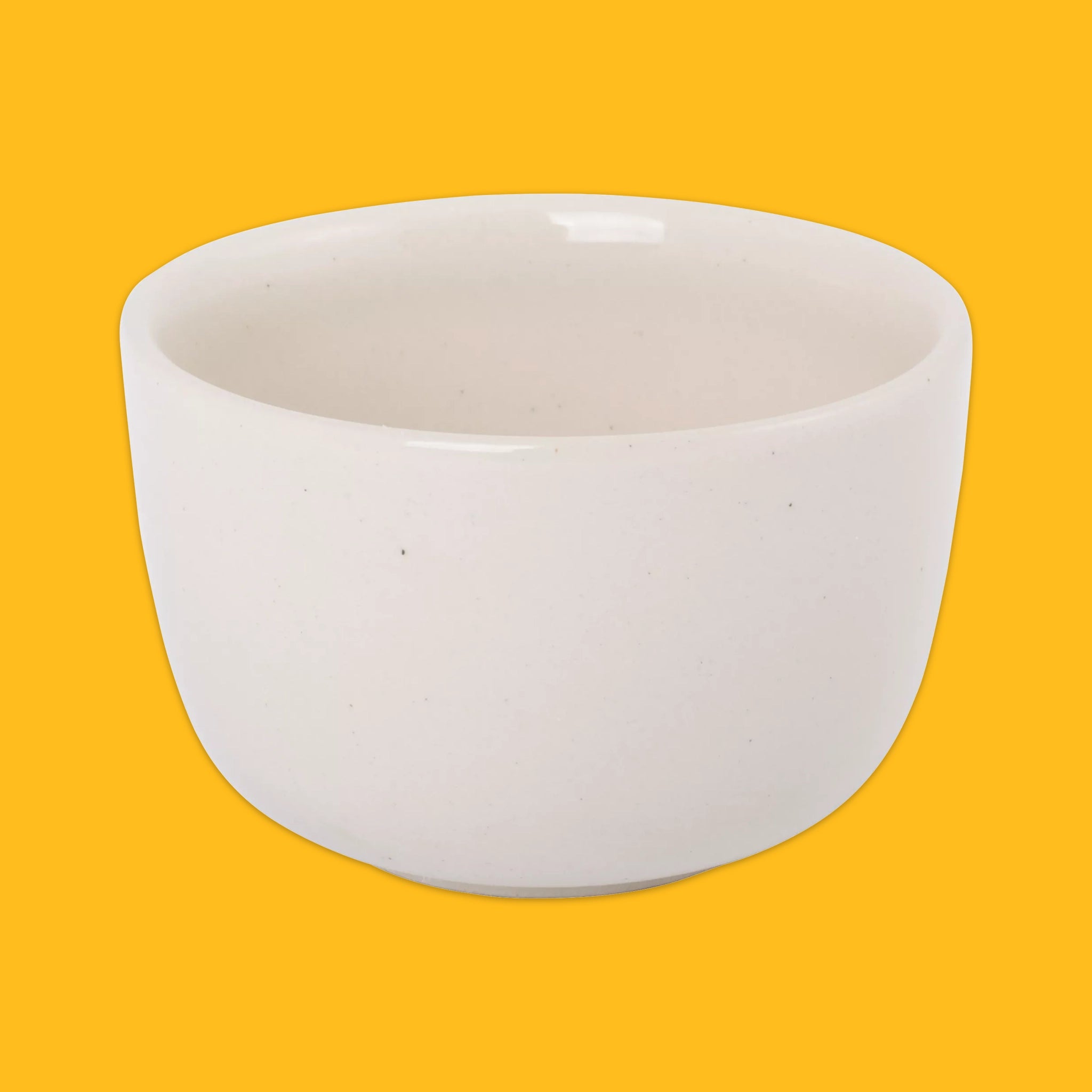 A plain white ceramic bowl with a gloss finish, shown from a front-facing perspective against a solid yellow background.