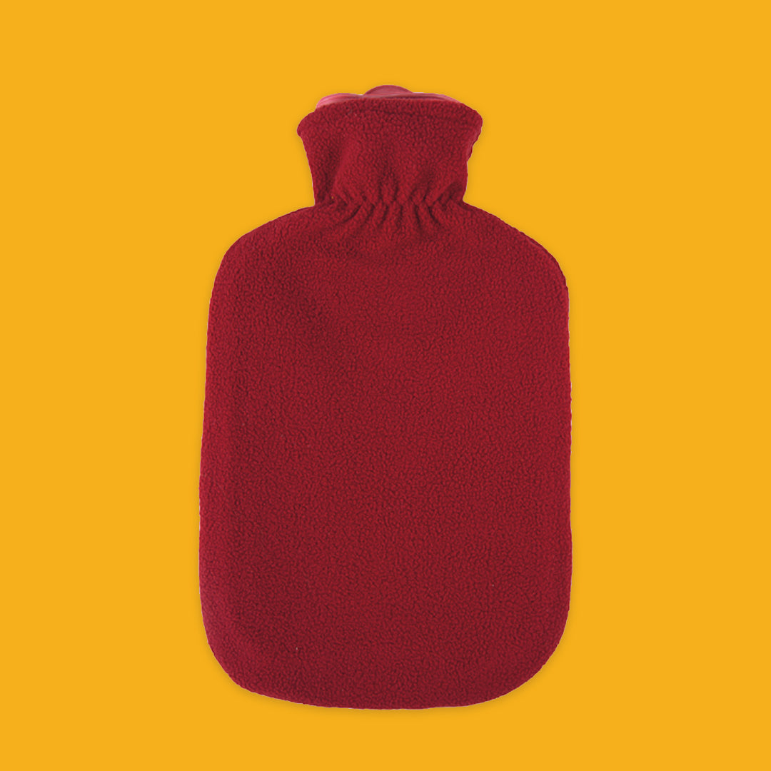Red hot water bottle on a yellow background