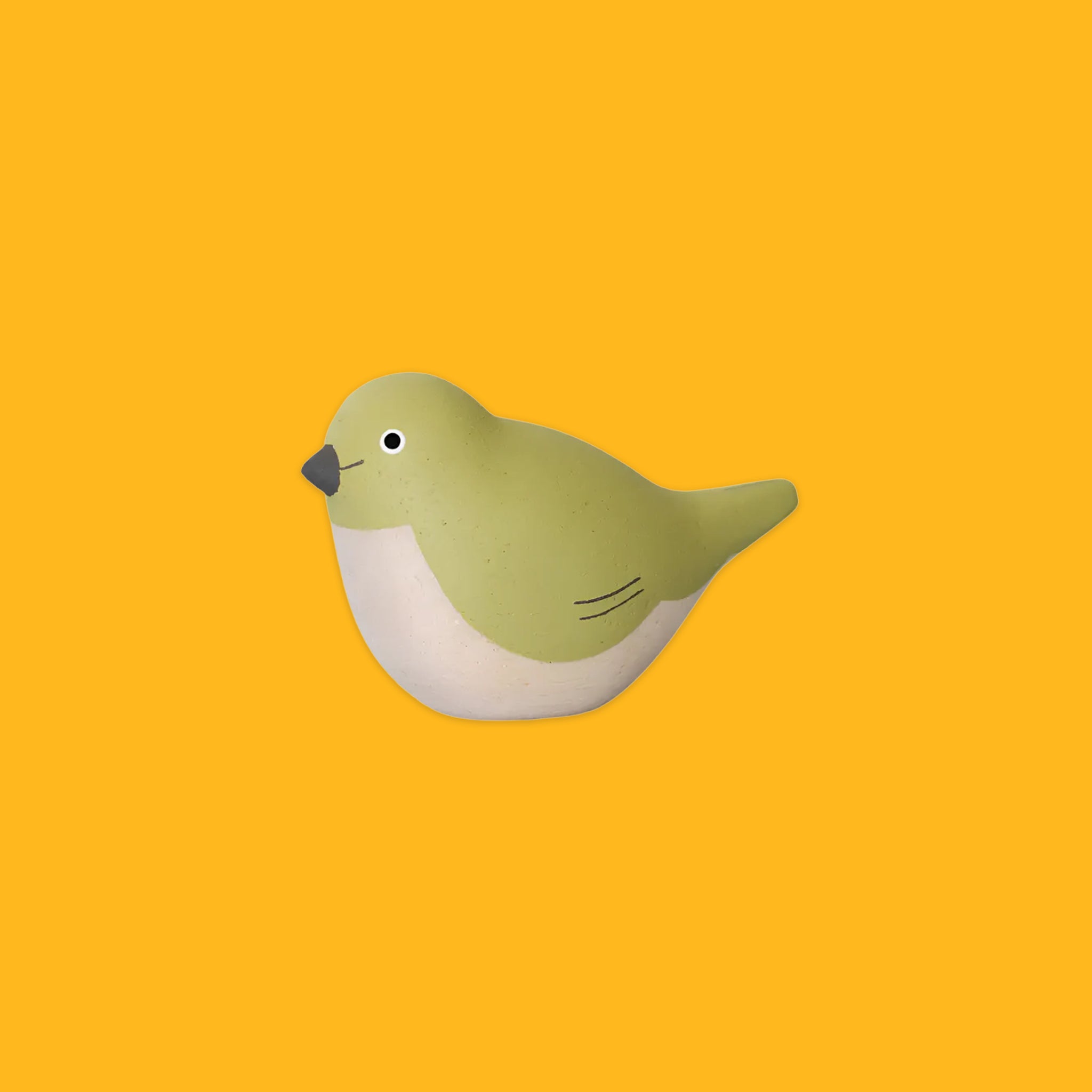 Green wooden bird on a yellow background
