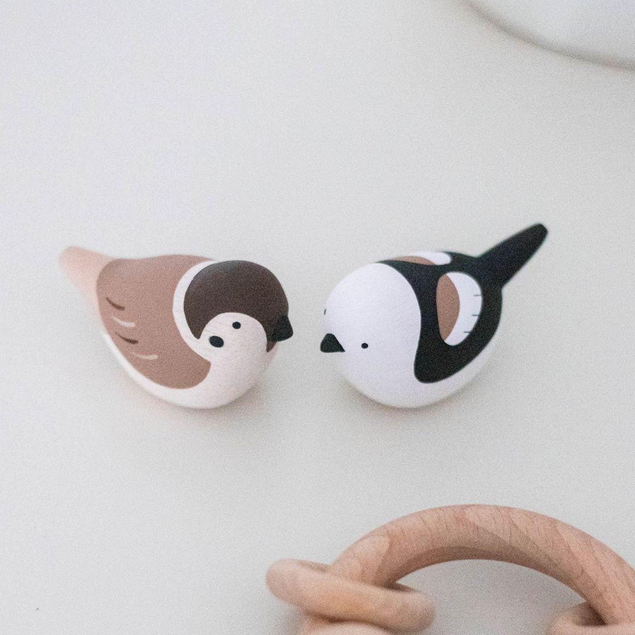 Wooden sparrow and tit on a table