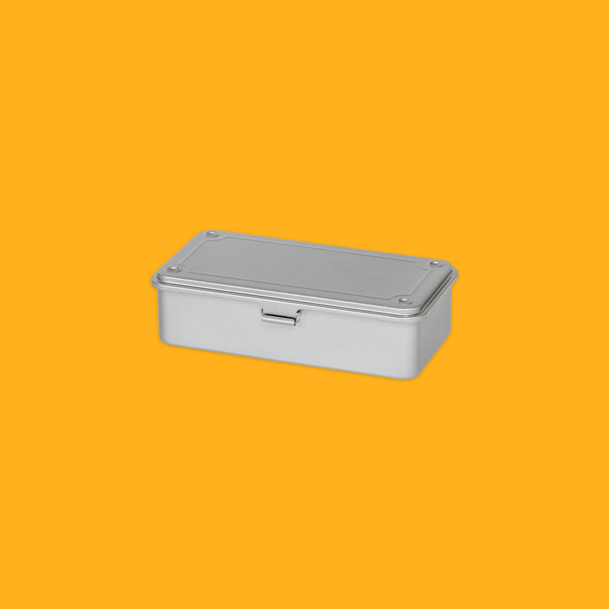 Metallic rectangular box with a lid on a yellow background