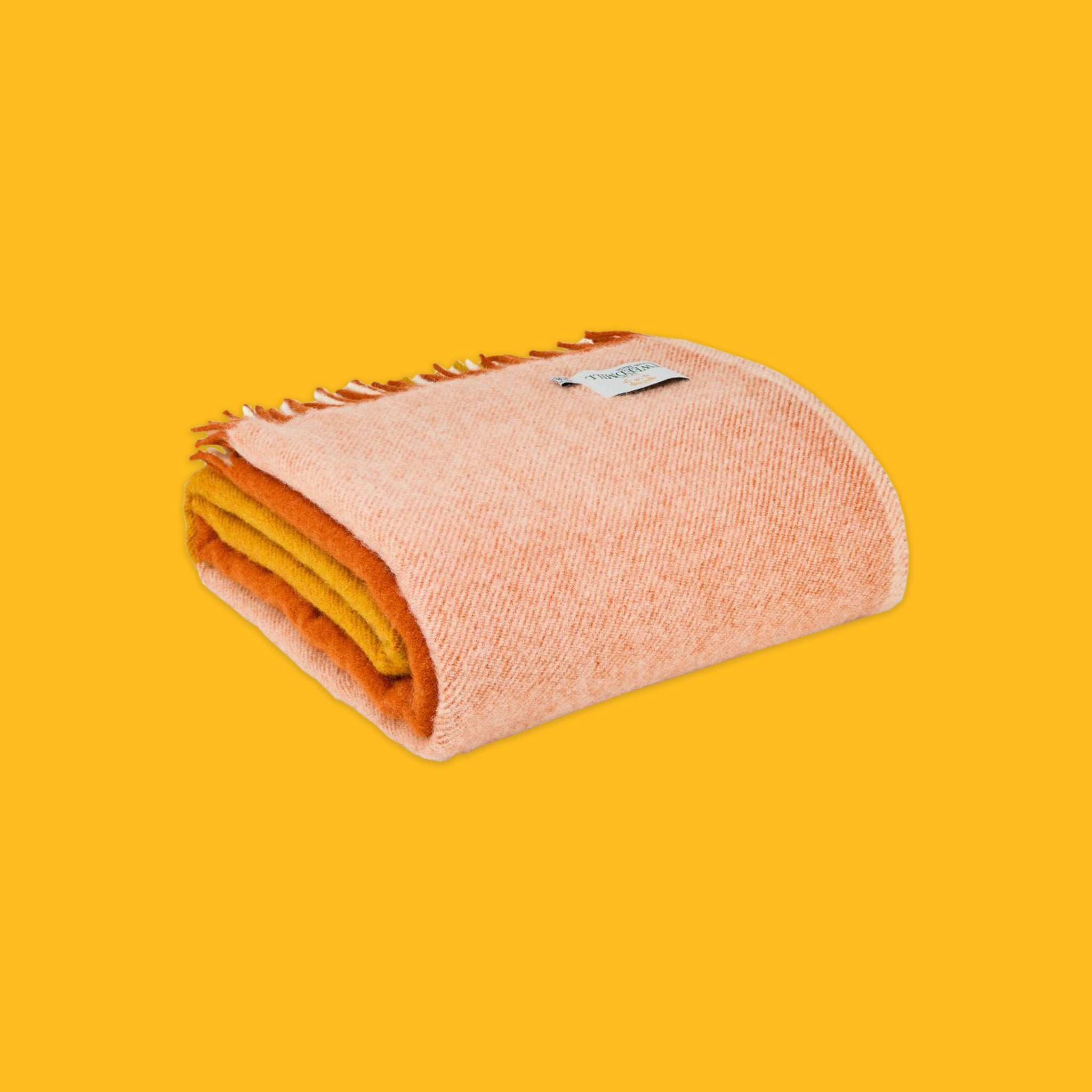 Folded Paddock Check Throw in Orange on a yellow background