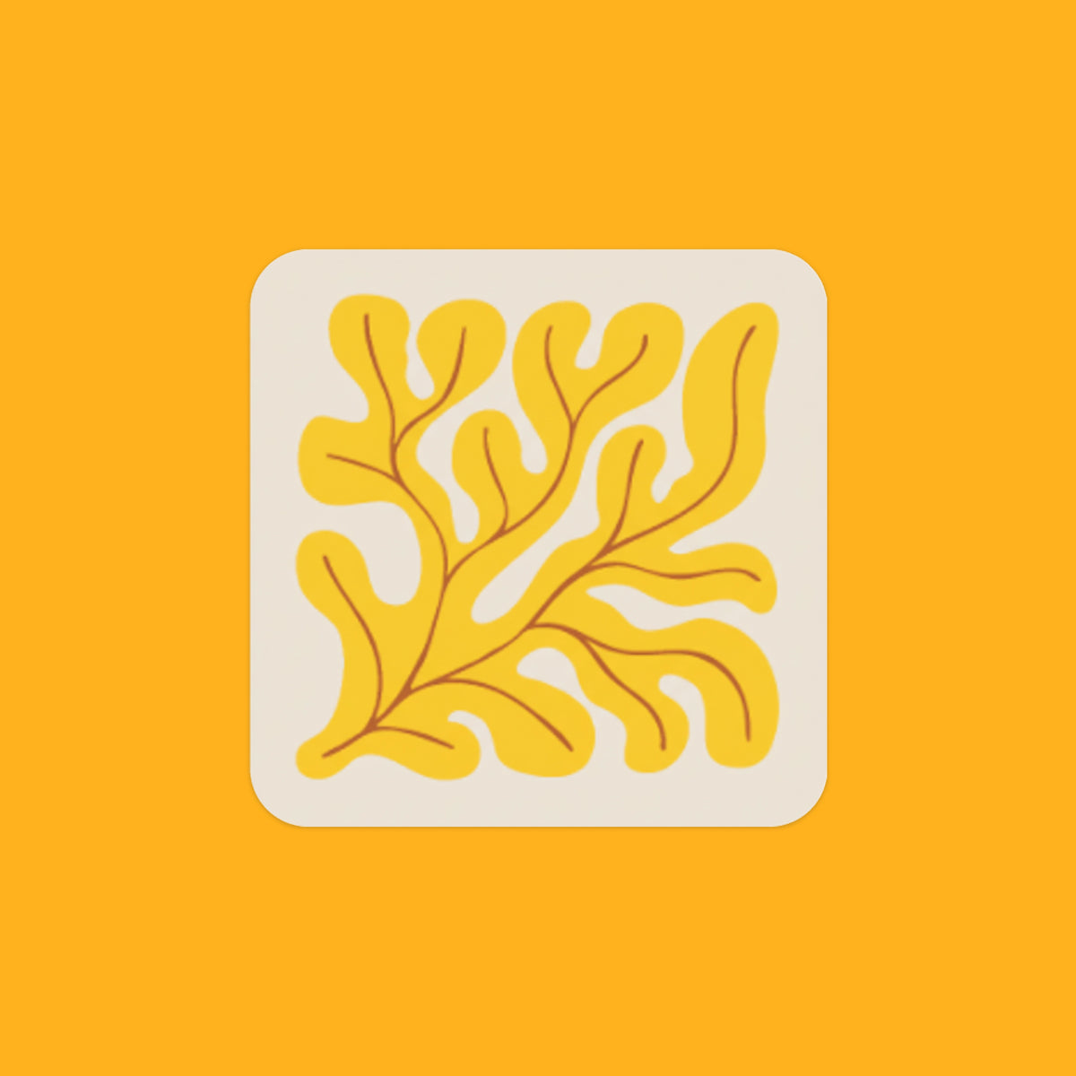 A recycled leather coaster with the image of lemon yellow seaweed on it.