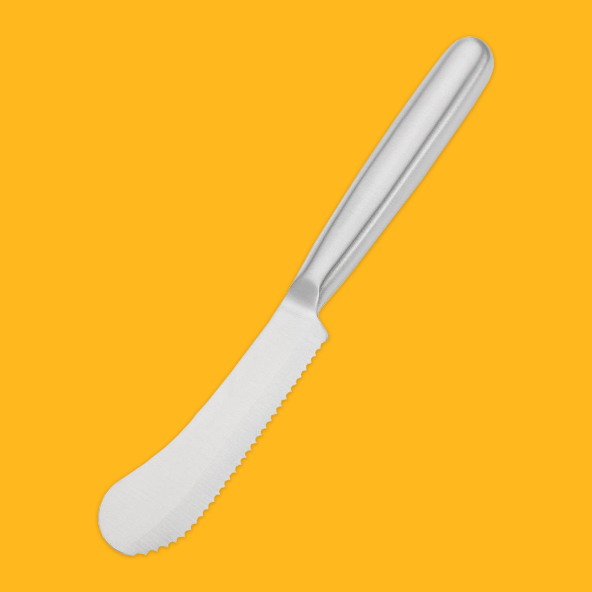 Stainless steel breakfast knife on an yeloow background