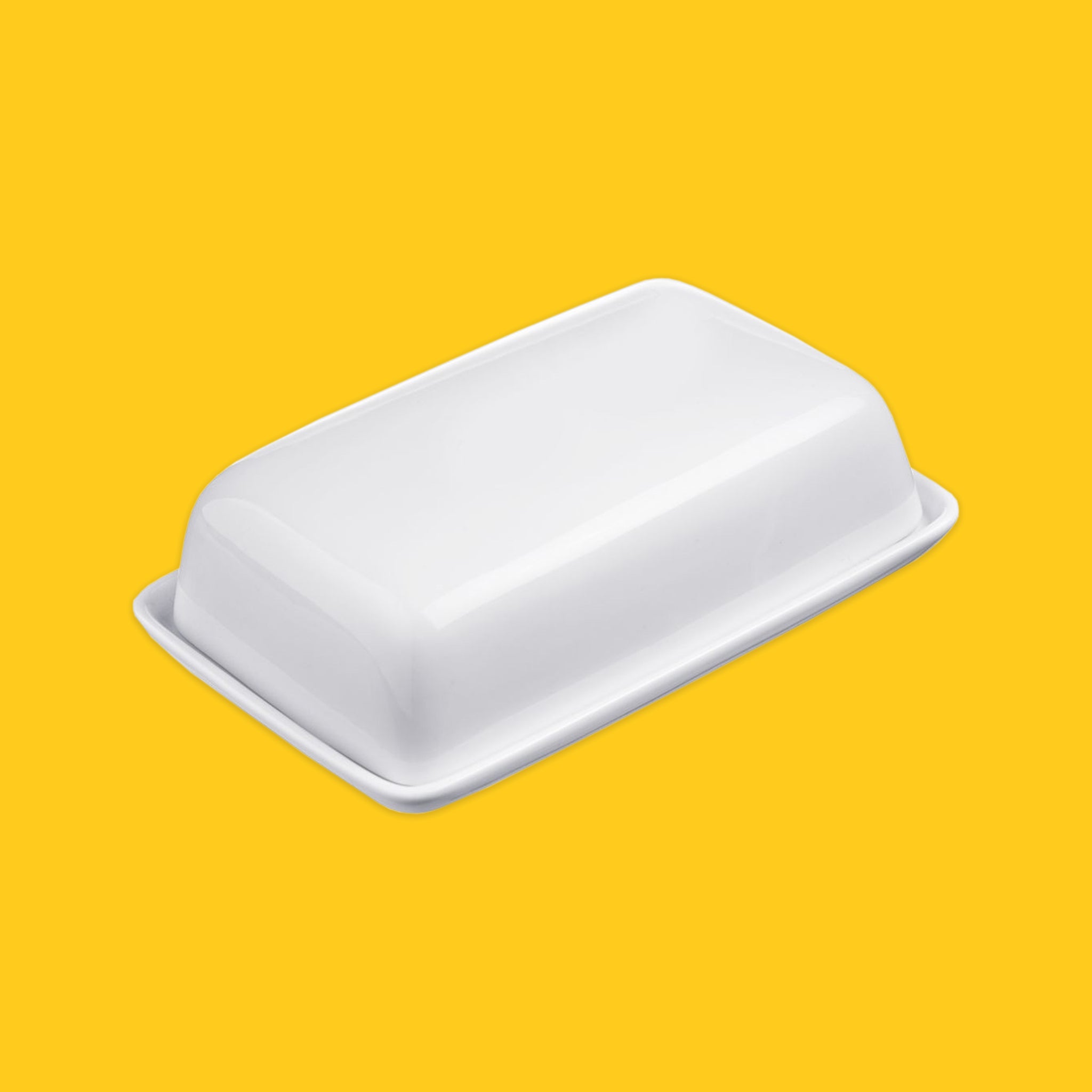 Ceramic butter dish on a yellow background
