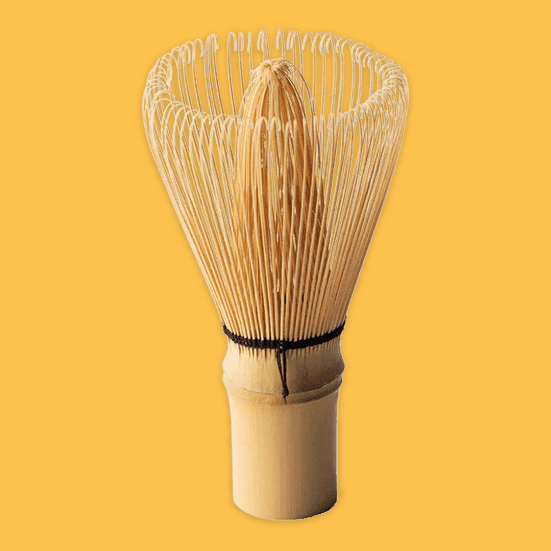 Matcha whisk on a yellow background
