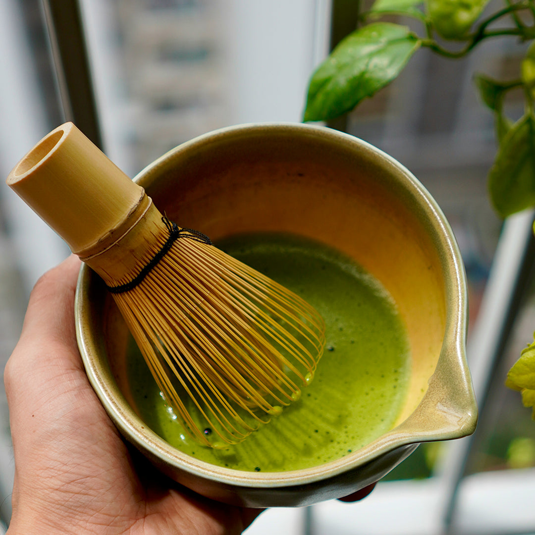 Matcha whisk in a bowl of matchaon at a window
https://unsplash.com/photos/hand-holding-a-matcha-bowl-with-whisk-P-MSAyU0erY?utm_source=unsplash&utm_medium=referral&utm_content=creditShareLink