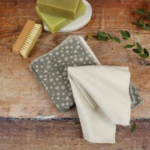 A Slice of Green Organic Cotton Reusable Wipes in Meadow Grey on display with green soap