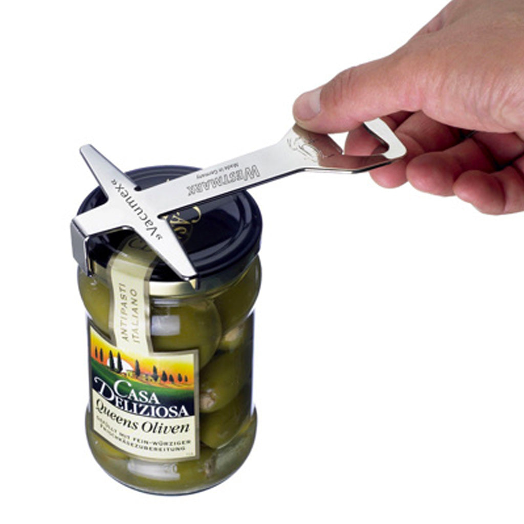 Westmark Vacumex Lid Opener Releasing vacuum on jar.